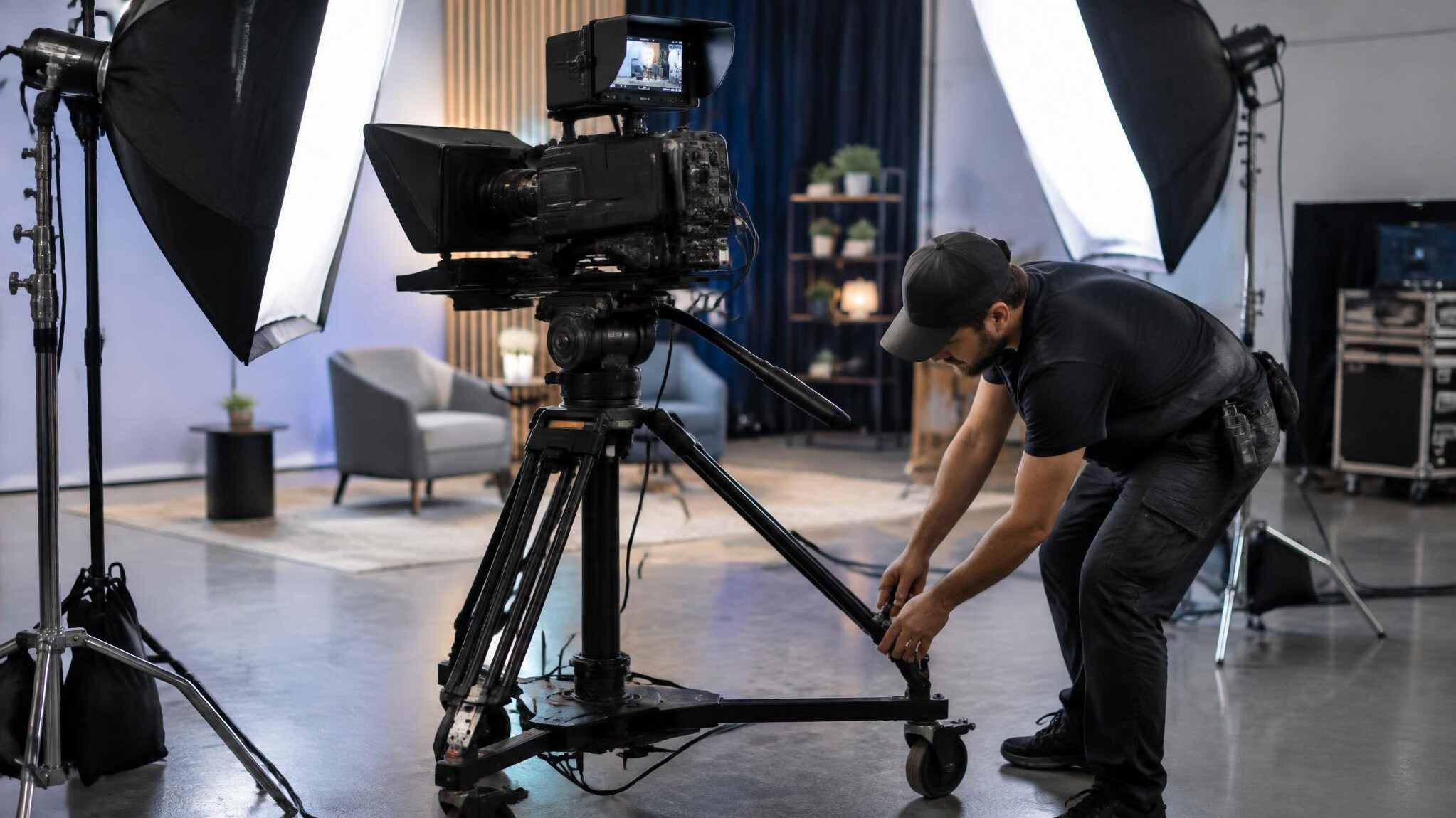 Studio camera rig with lighting equipment being set up